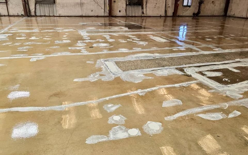 Cracks and surface defects repaired before coating the JAXPORT body shop floor
