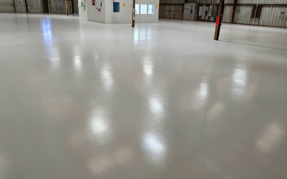 Wide view of the completed JAXPORT body shop epoxy floor
