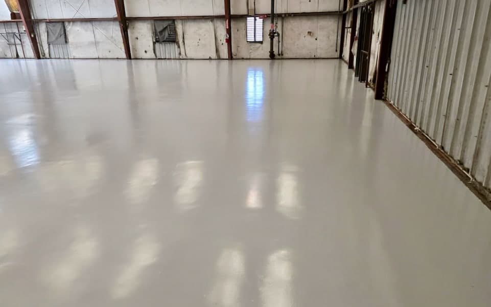 Completed moisture-protected epoxy floor along the body shop perimeter