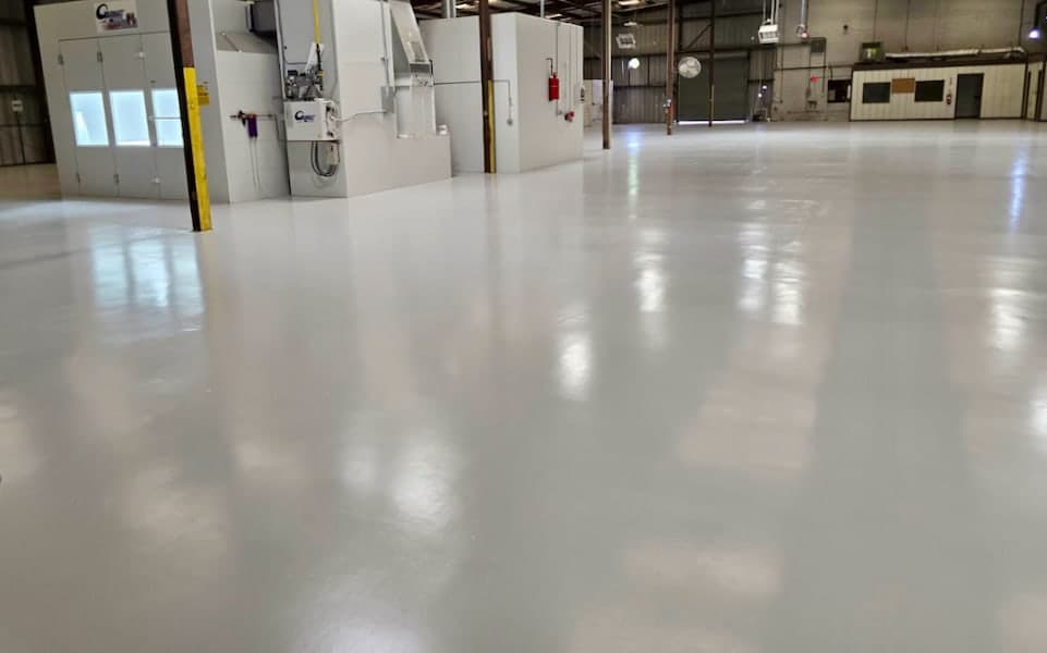Completed JAXPORT body shop epoxy floor surrounding automotive paint booths